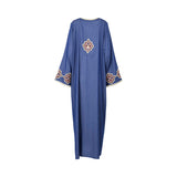 Back view of the Nero women's blue jalabiya with gold geometric embroidery. Available Online Now
