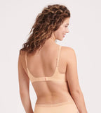 Back view of the Sloggi Body Adapt Twist T-shirt bra in powder orange, showing the adjustable straps and back closure. Shop Now Online