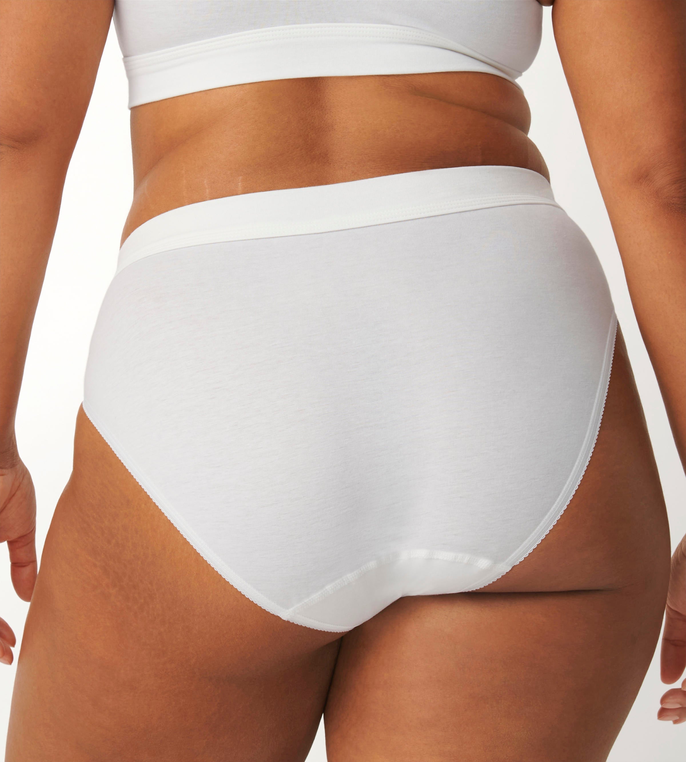 Back view of the Sloggi Ever Ease white Tai panty, highlighting the flattering high-cut leg and crisp white fabric. Shop Online Today