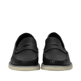 Front-facing view of a pair of Baldinini black leather loafers showcasing the symmetrical perforated texture, traditional penny straps, and sturdy stitched toe boxes against a white background.