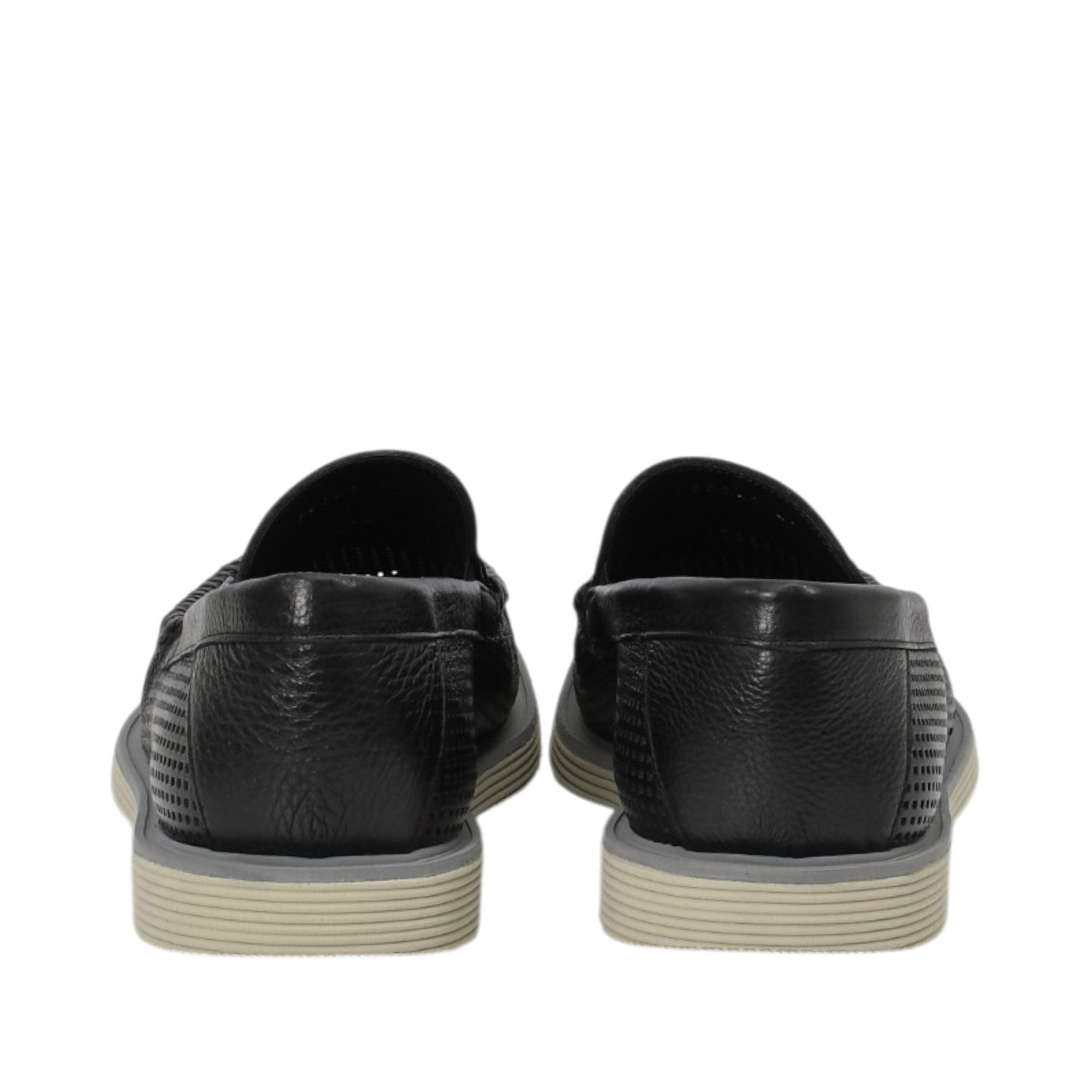 Rear view of a pair of Baldinini black loafers showing the pebbled leather heel counter, smooth top-line trim, and the layered edge of the comfortable beige rubber sole against a white background.