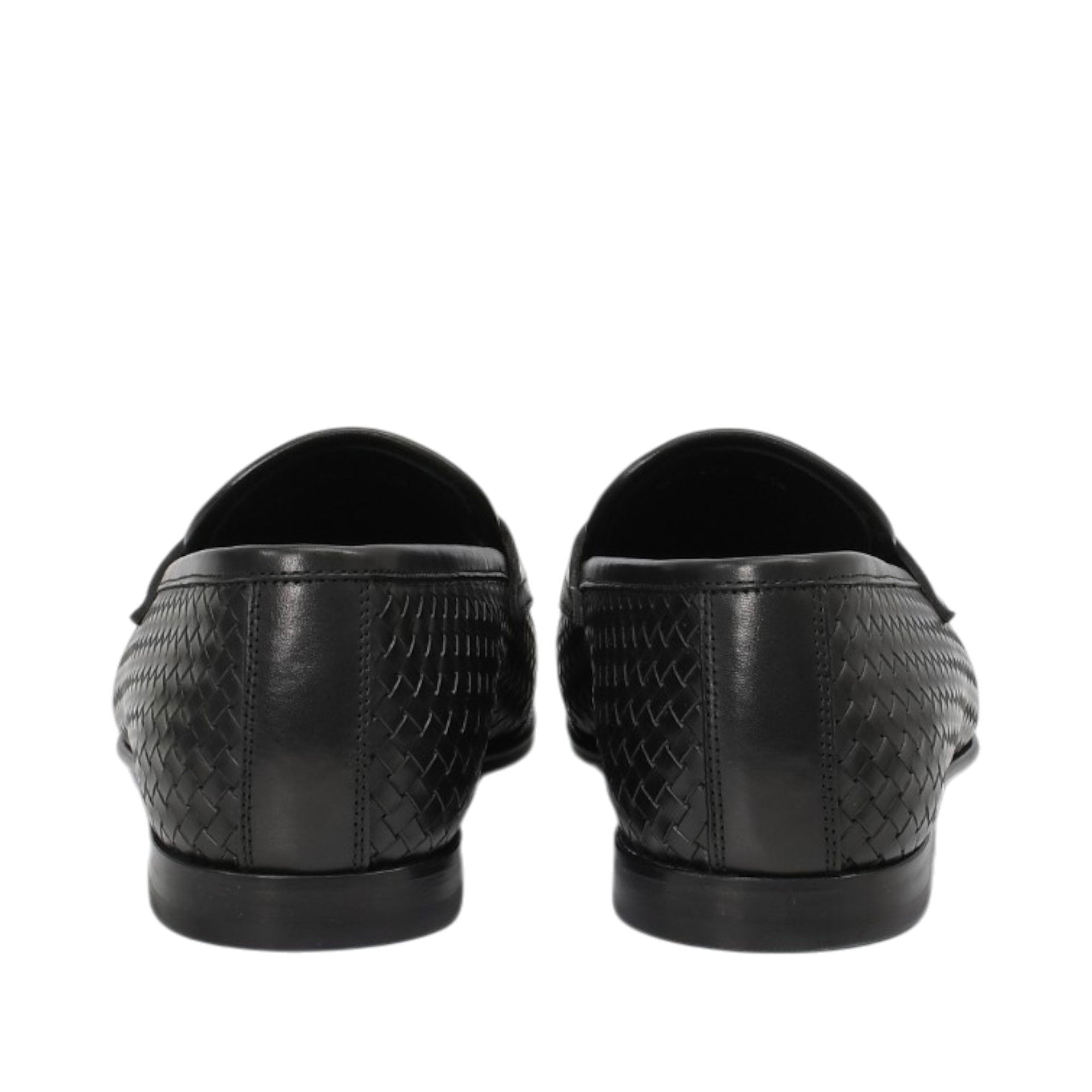 Rear view of a pair of Baldinini black woven loafers highlighting the vertical heel seam construction, clean top-line leather piping, and the low-profile black rubber outsoles against a white background.