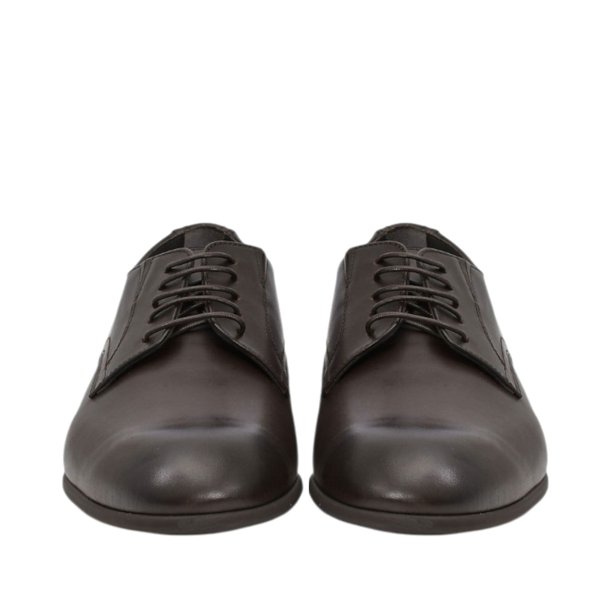 Front-facing view of a pair of Baldinini dark brown Derby shoes highlighting the clean almond toe boxes and symmetrical four-eyelet lace-up design against a white background.