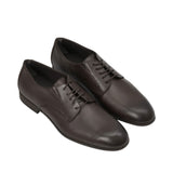 An overhead three-quarter angle view of a pair of Baldinini dark brown leather Derbies, displaying the smooth texture of the leather vamp and comfortable low-top collar against a white background.