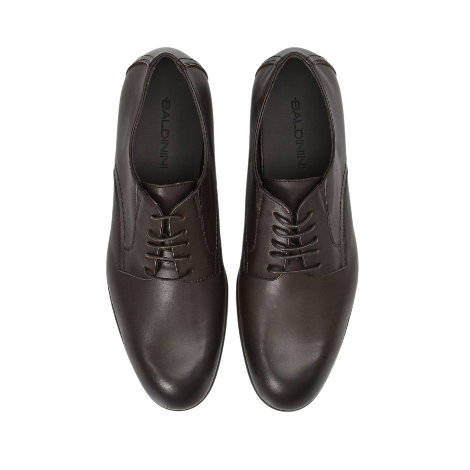 Direct top-down view of a pair of Baldinini Derby shoes, showing the dark brown insoles stamped with the black Baldinini brand name framed by the structured leather uppers against a white background.