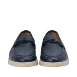 Front-facing view of a pair of Baldinini navy leather loafers, showcasing the symmetrical rounded toe boxes and the distinctive interlocking double-B logo hardware across the vamps against a white background.