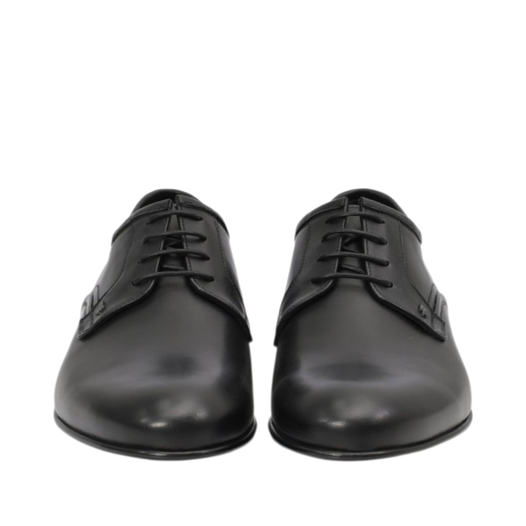 Front-facing view of a pair of Baldinini black dress shoes showcasing the smooth almond toe caps and the neat open-lacing system with thin tonal laces against a white background.