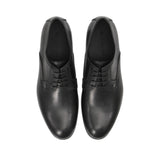 Direct top-down view of a pair of Baldinini dress shoes showing the black leather insoles cleanly debossed with the silver-toned Baldinini brand name and Made in Italy stamp against a white background.