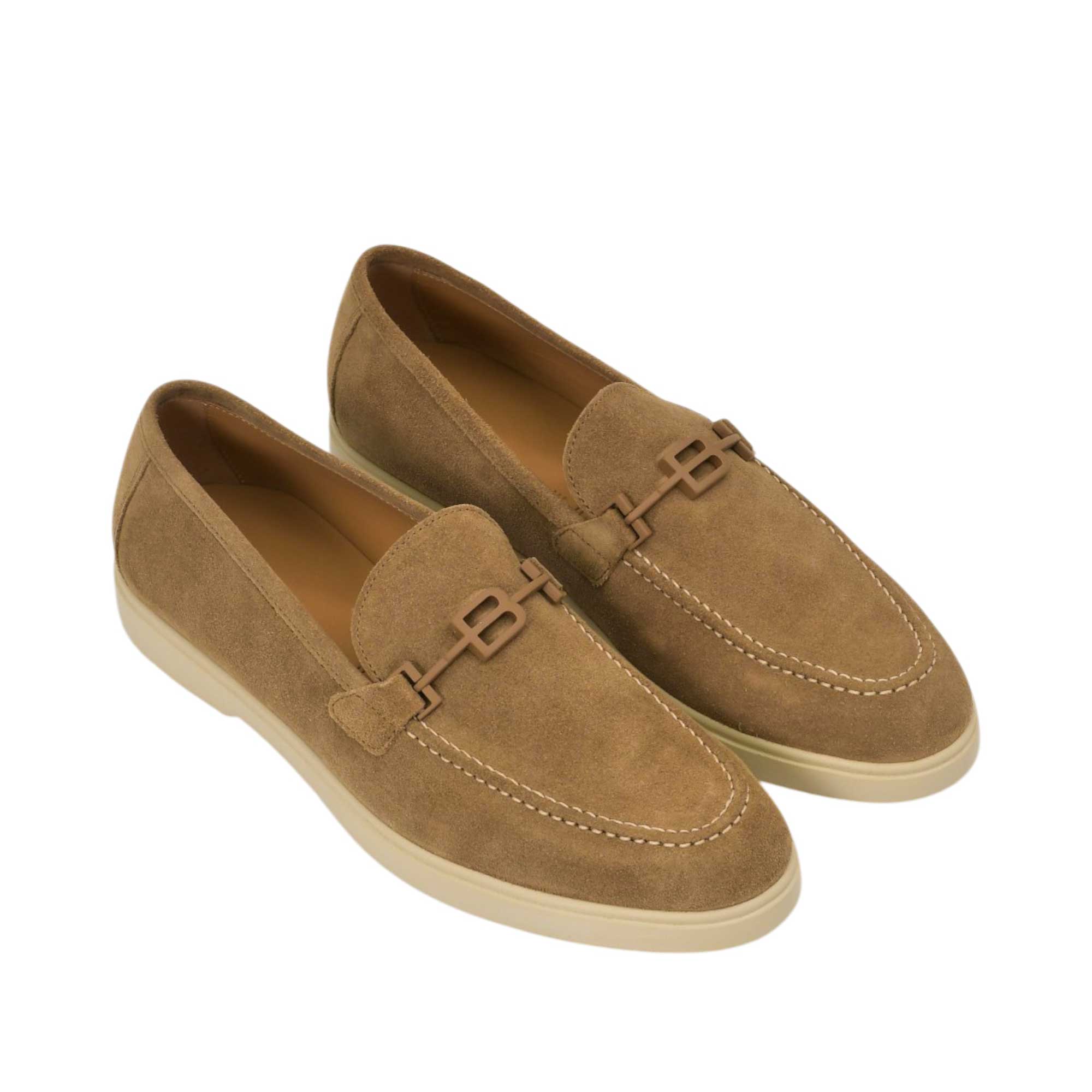 An overhead three-quarter angle view of a pair of Baldinini tan slip-on loafers, highlighting their rich velvety suede texture and relaxed luxury styling against a white background.