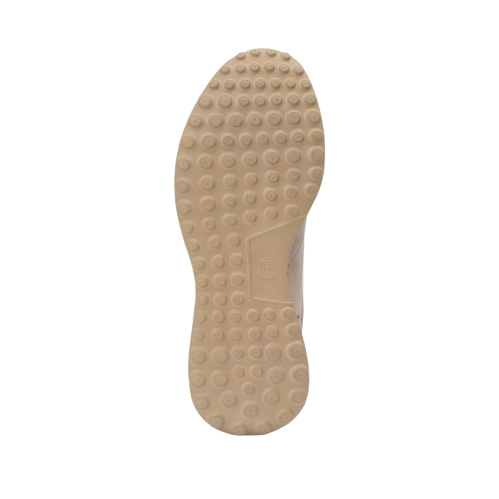 Bottom view of the Baldinini sneaker outsole showcasing the tan-colored flexible rubber base covered in a continuous raised circular stud texture for superior grip against a white background.