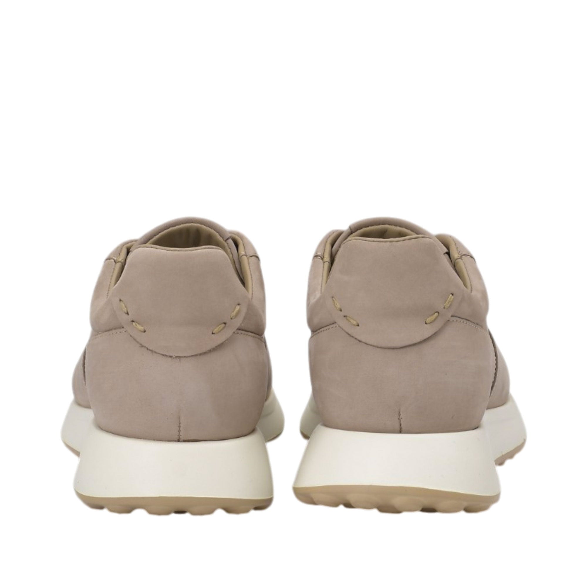 Rear view of a pair of Baldinini taupe leather sneakers showcasing the clean nubuck heel counters with minimalist tonal accent stitching and the flared off-white midsoles against a white background.