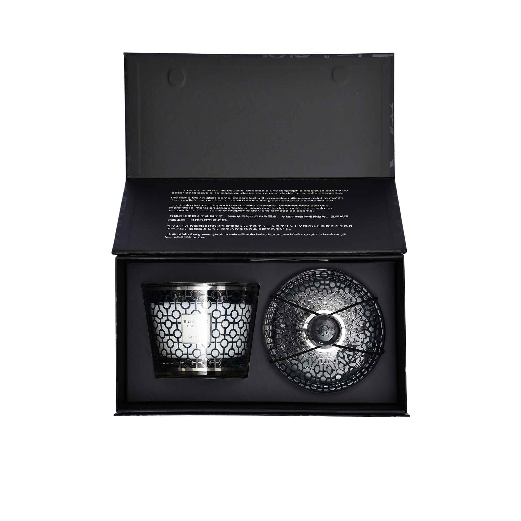 Open view of the luxury black gift box for the Gentlemen candle set, showing the protective interior and descriptive text on the lid.