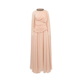 A floor-length draped gown in a soft blush pink color, featuring a high mock neck with a beaded metallic trim, long sleeves, and a gathered twisted detail at the waist, shown against a plain white background.
