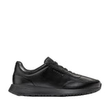 Black Cole Haan GrandPrø Luxe Mile slip-on sneakers with smooth leather upper, stretch laces, and a chunky black sole.