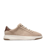 Pair of men's beige suede low-top sneakers with a white sculpted midsole, brown rubber outsole, and a metallic brown heel acc