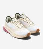 Off-white mesh running sneakers with cream overlays, olive green collar, gold-toned eyelets, cream sole with pink heel accent
