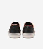 Black sneakers with light brown collar trim, off-white soles, and embossed 'CH' logo on heels. 'COLE HAAN' on soles.