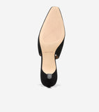Back view of a black suede slingback pump with a pointed toe, low block heel with silver-toned ridged detail, and tan sole wi
