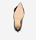 Dark brown crocodile-embossed pump with a pointed toe, light tan sole, small dark heel, and a dark decorative element on the