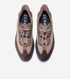 Tan mesh sneakers with brown and dark blue accents, dark purple trim, quick-on laces with a toggle, and gold-toned text on in