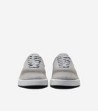 Pair of light gray low-top sneakers with laser-cut perforated uppers, gray laces, and thick white platform soles. CH logo on