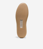 Tan rubber sole with horizontal ridges and a silver-toned plaque featuring "COLE HAAN" and "GRAND360" text.