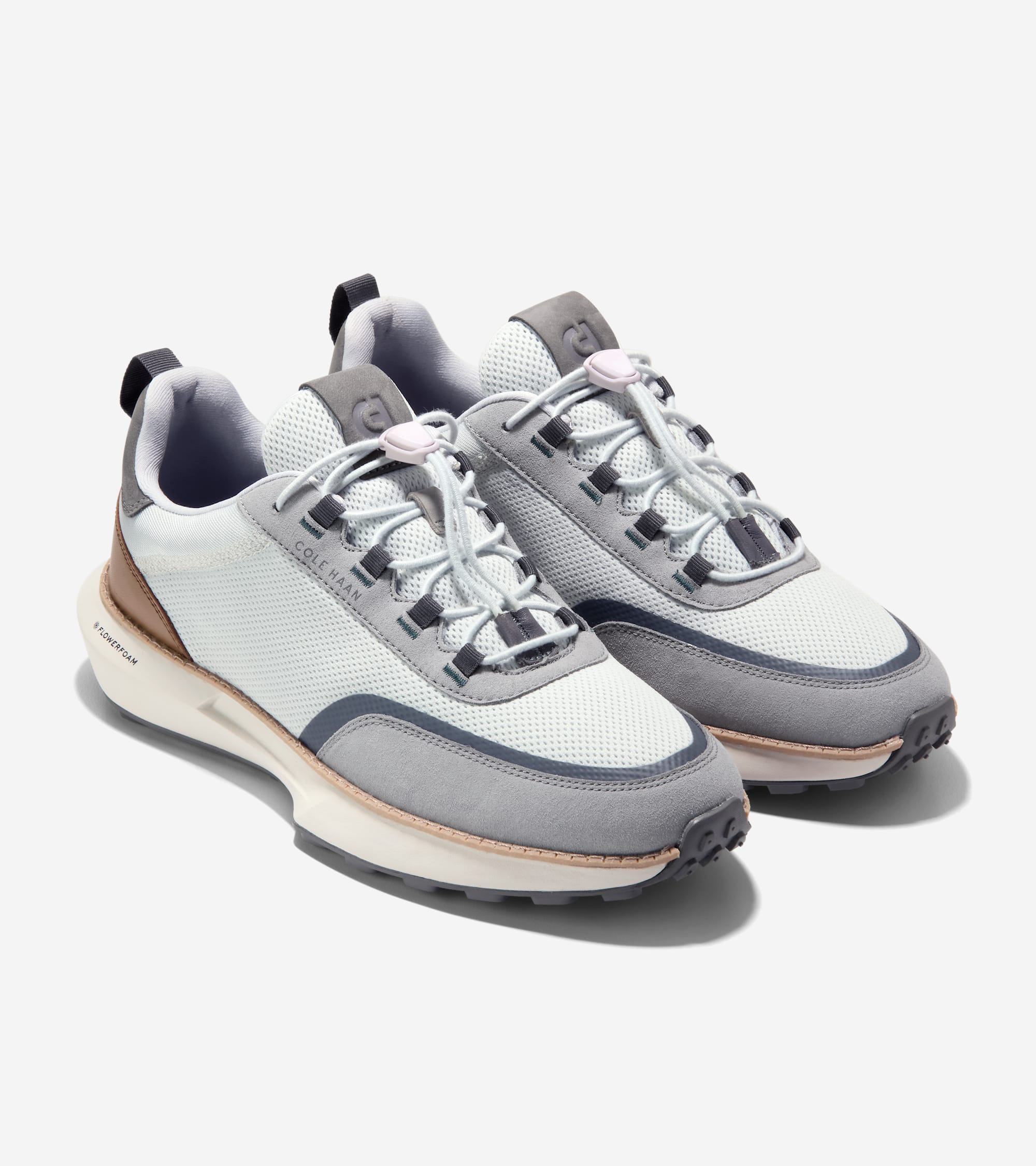 Pair of light blue mesh and grey suede sneakers with dark grey accents, light blue toggle laces, and white soles with tan tri
