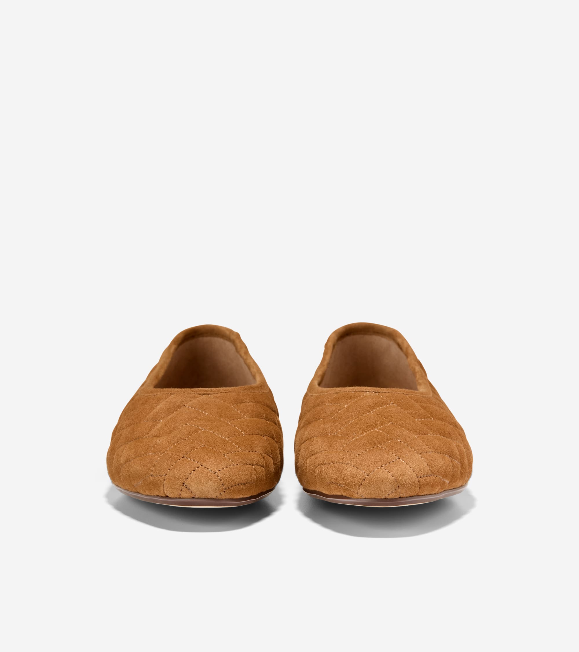 Pair of brown suede ballet flats with rounded toes and a chevron quilted pattern.