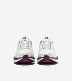 White running sneakers with white laces, magenta trim, and a thick sole featuring dark purple and magenta layers.