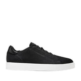 Black Cole Haan GrandPrø Luxe slip-on knit sneakers with white flat sole and black leather heel accent.