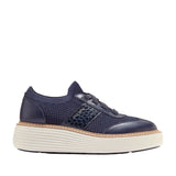 Navy blue knit and leather platform sneakers with a textured side panel and an off-white ridged sole.