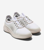 Pair of white mesh sneaker oxfords with light beige trim, perforated side panels, white laces, and a cream-colored ribbed sol