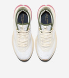 Pair of off-white mesh running sneakers with cream overlays, olive green collar trim, pink heel accent, and gold-toned eyelet