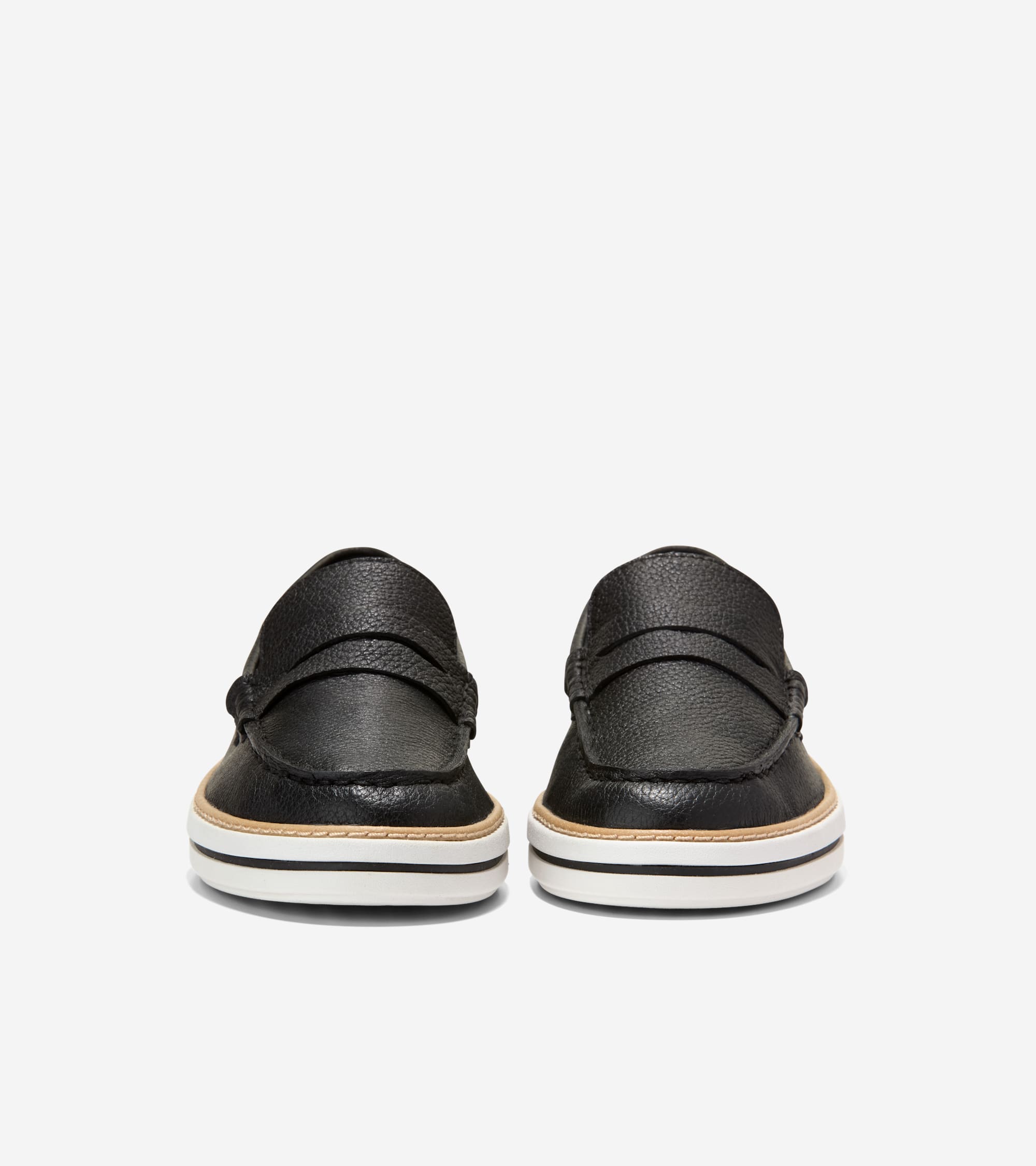 Black pebbled leather penny loafers with a strap across the vamp and a layered tan, white, and black platform sole.