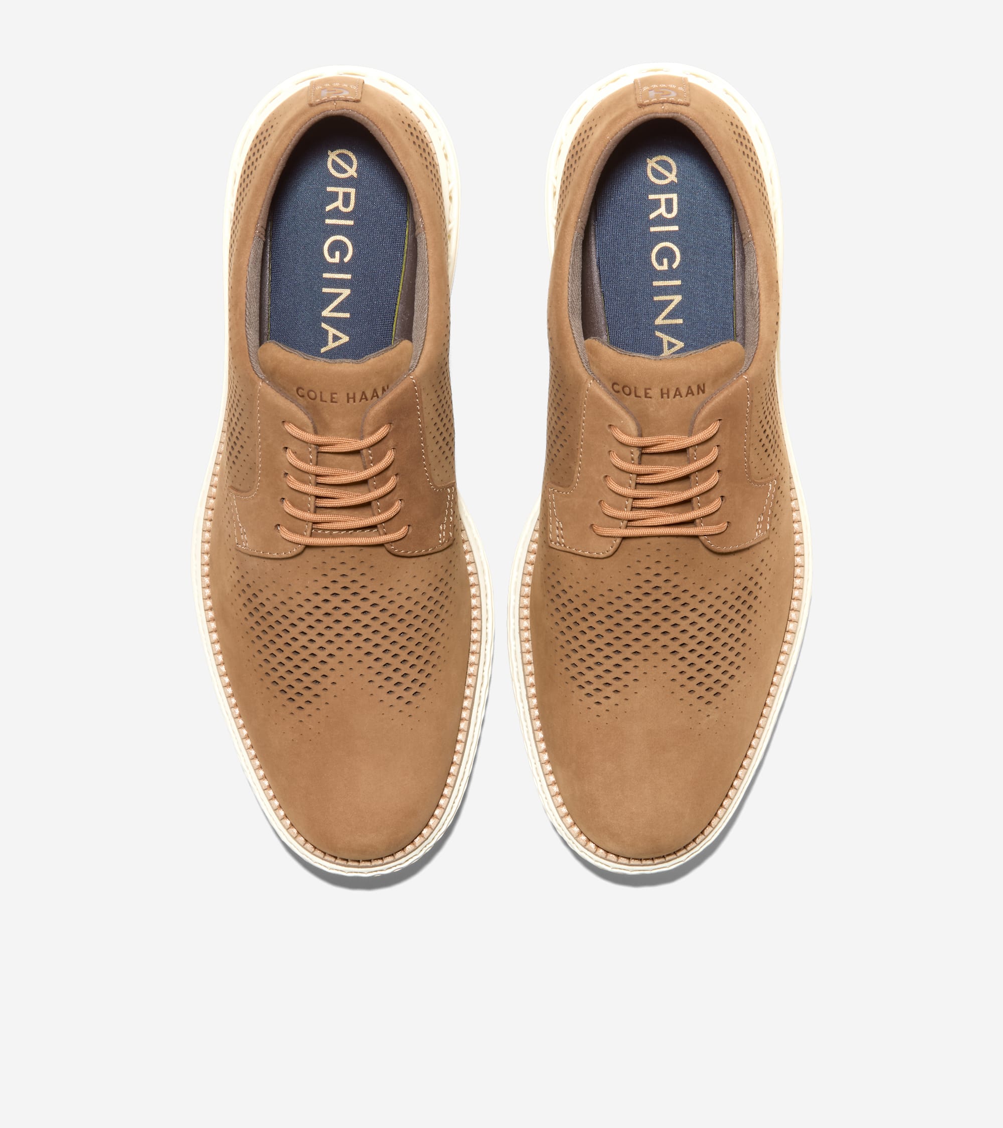 Pair of tan perforated suede oxfords with tan laces, white soles, and blue insoles.