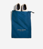 Pair of off-white low-top sneakers with dark blue insoles featuring gold-toned Cole Haan branding.