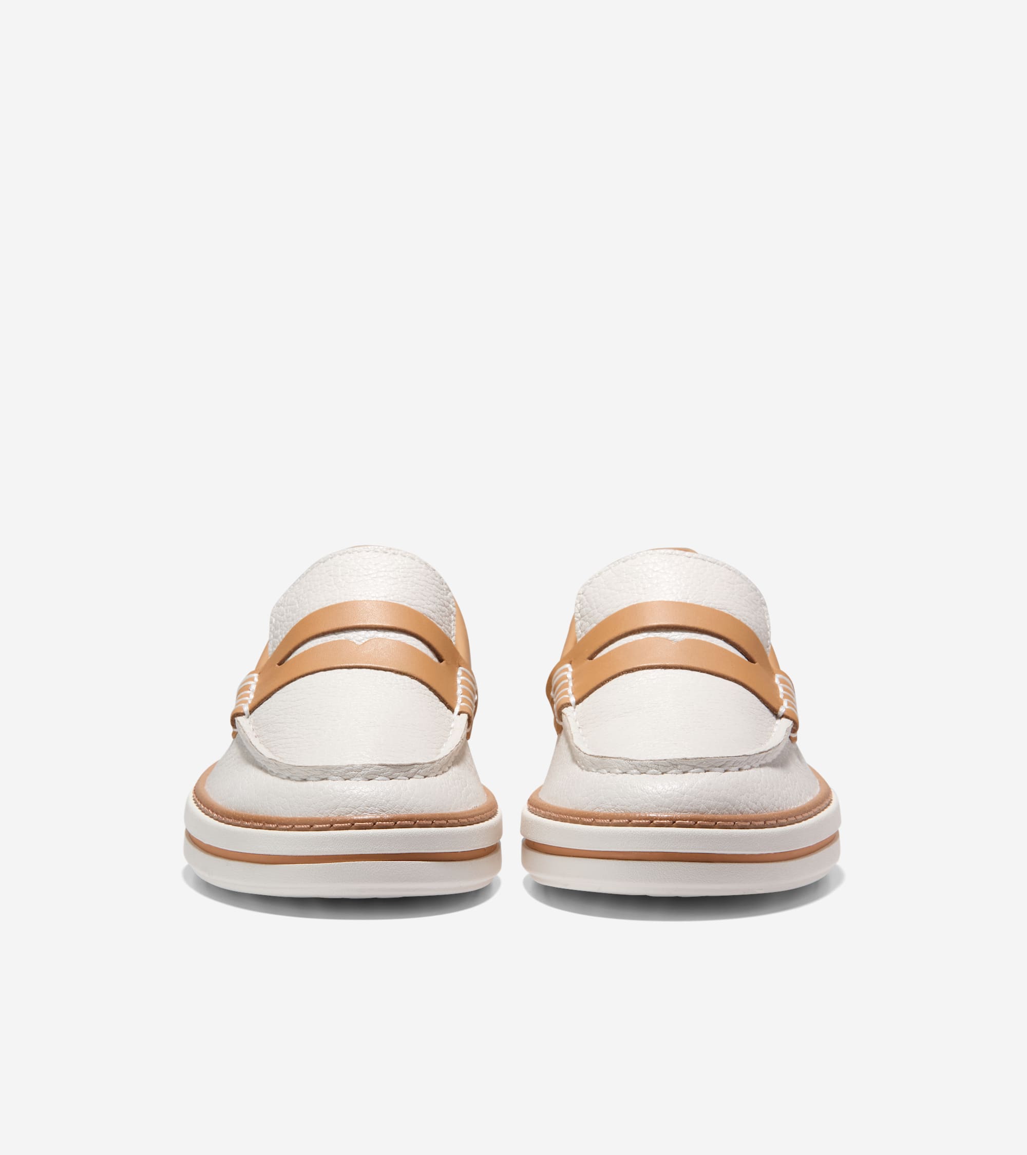 Off-white textured leather penny loafers with tan penny straps, moccasin stitching, and a thick white sole with a tan stripe.