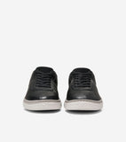 Pair of black pebbled leather low-top sneakers with black laces and light grey soles featuring a thin grey stripe.