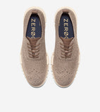 Pair of light brown knit wingtip oxfords with perforated details, brown laces, leather-like trim, and cream textured soles.