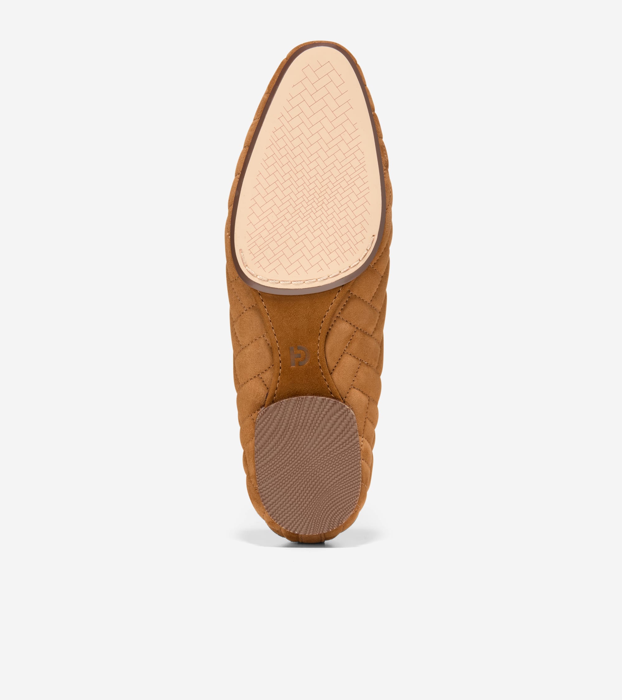 Cognac suede quilted ballet flat, seen from the sole. Features a light tan woven toe pad and a darker brown ribbed heel pad.