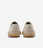 Light beige sneakers with textured uppers, suede heel panels, and translucent gum soles. Embossed 'CH' logo on heels, 'COLE H