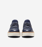 Pair of navy blue knit and leather platform sneakers with matching laces and thick ridged off-white soles.