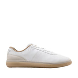 White Cole Haan GrandPrø Packwell low-top sneakers with a light brown suede heel panel and a natural-toned rubber sole.
