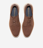 Pair of brown knit oxfords with brown laces, white midsoles, tan outsoles, and croc-embossed heel collars. Gold-toned text on