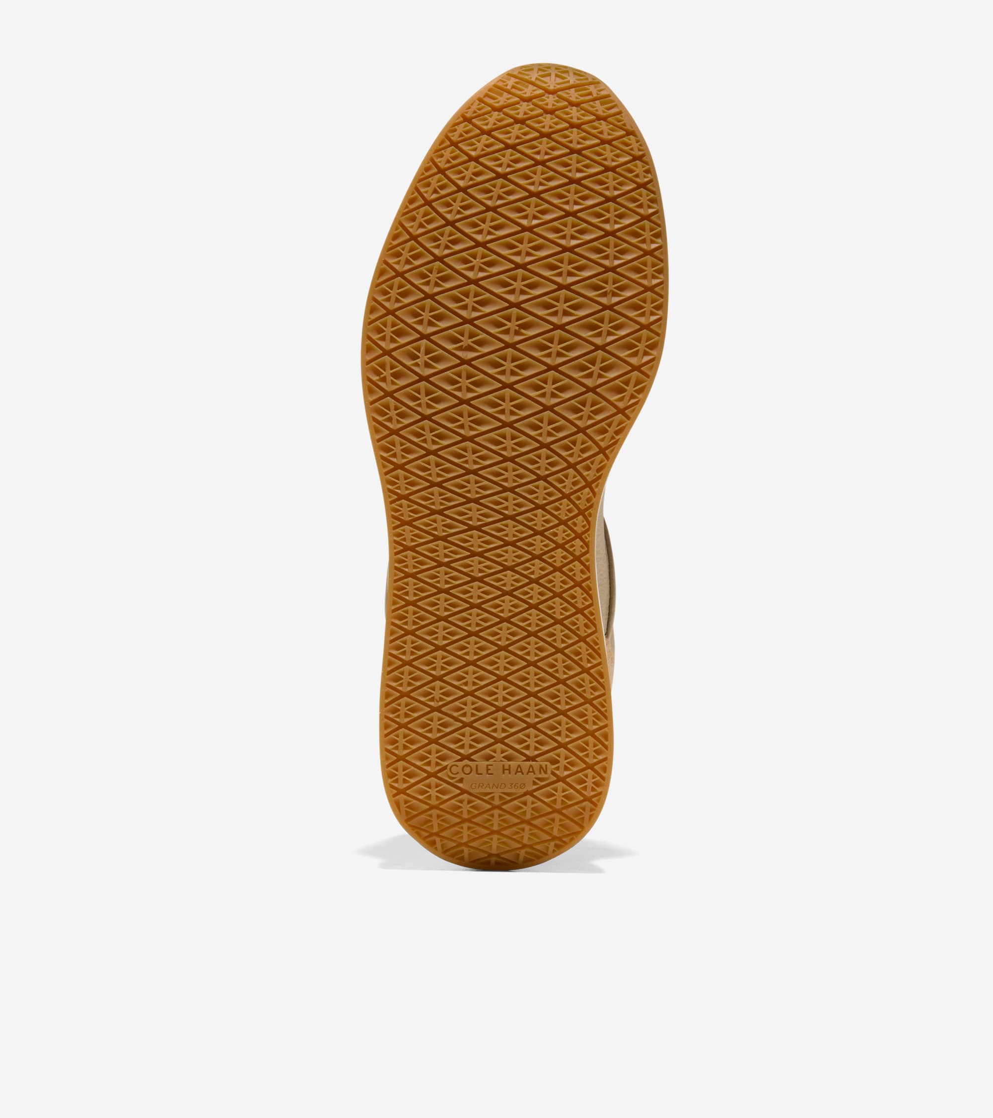 Light brown sneaker sole with a diamond grid traction pattern. 'COLE HAAN GRANDPRO' is embossed near the heel.