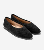 Black quilted suede ballet flats with a thin black sole and light tan interior.