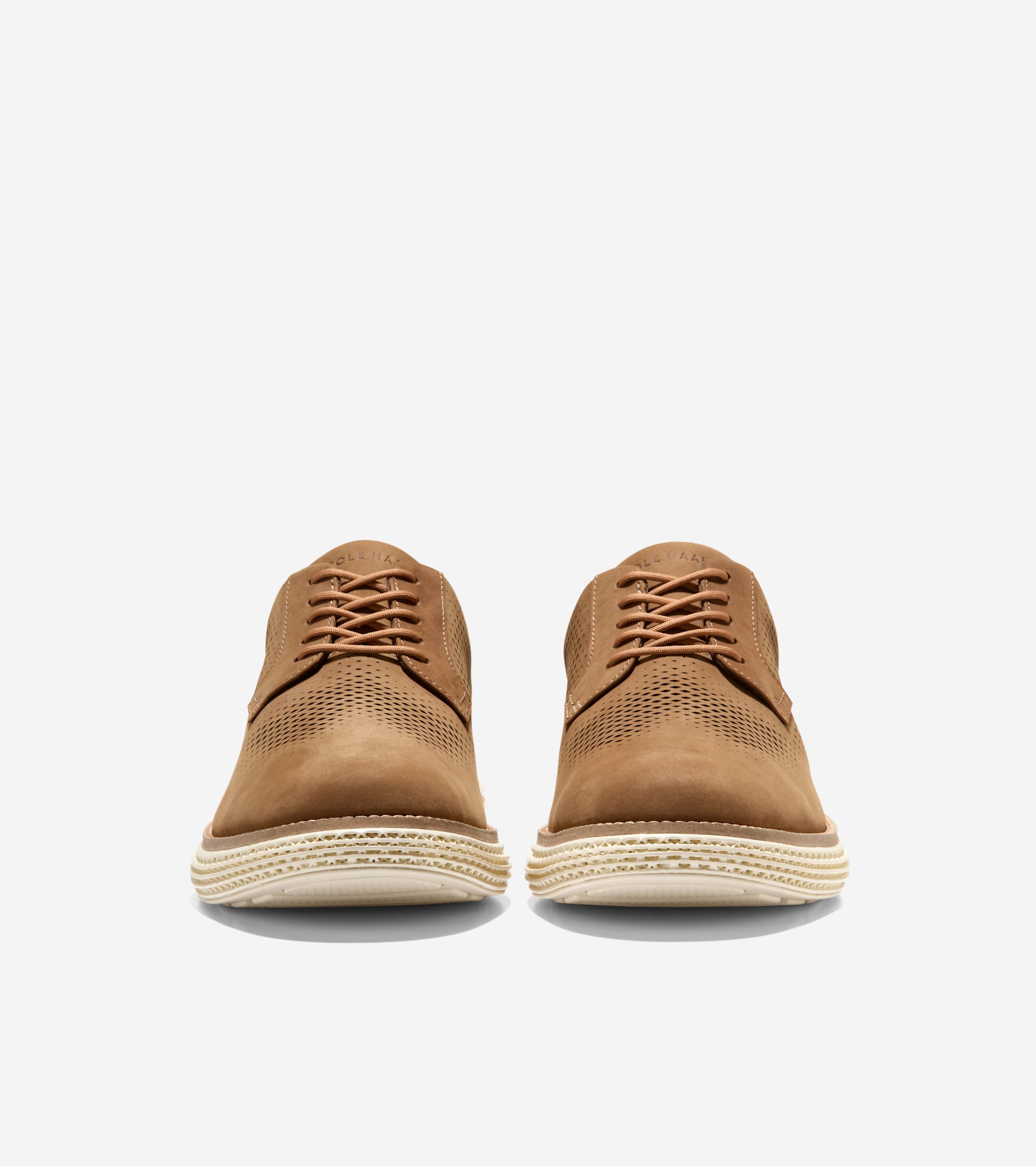 Tan perforated leather oxfords with matching laces and thick, textured espadrille-style soles.