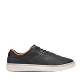 A single black Cole Haan GrandPrø Packwell sneaker with a white cupsole and tan collar trim, viewed from the side.