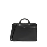Black Cole Haan slim briefcase with top handles, a shoulder strap, dual silver-toned zip closure, and a front zip pocket.