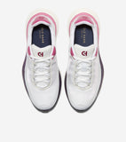 Pair of white mesh running sneakers with pink collar trim, dark red CH logo on tongue, and dark purple soles.